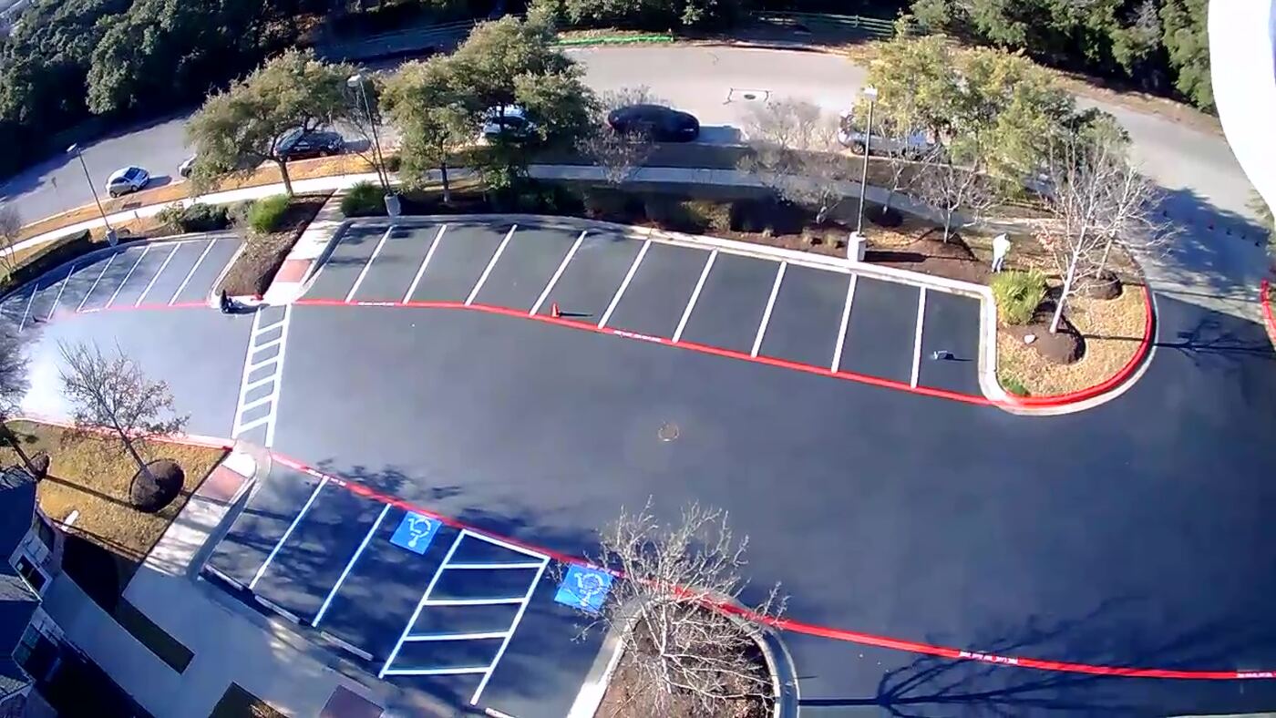 ADA compliant parking spaces and curb painting, aerial view