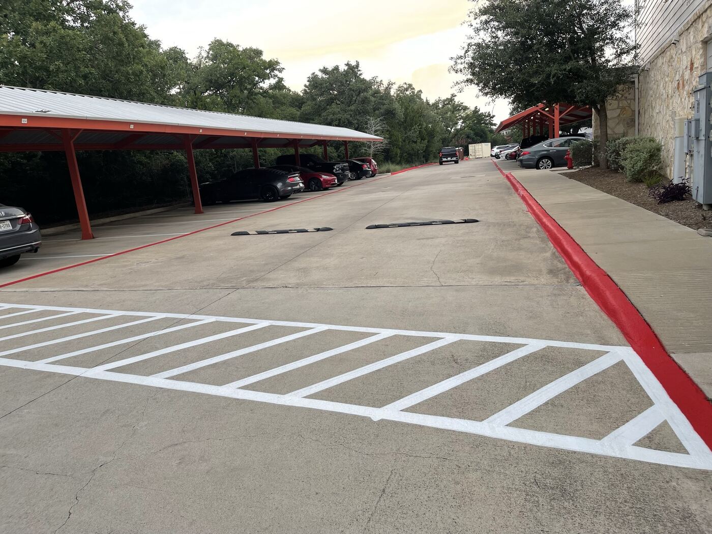 Curb painting and loading zone striping with covered parking